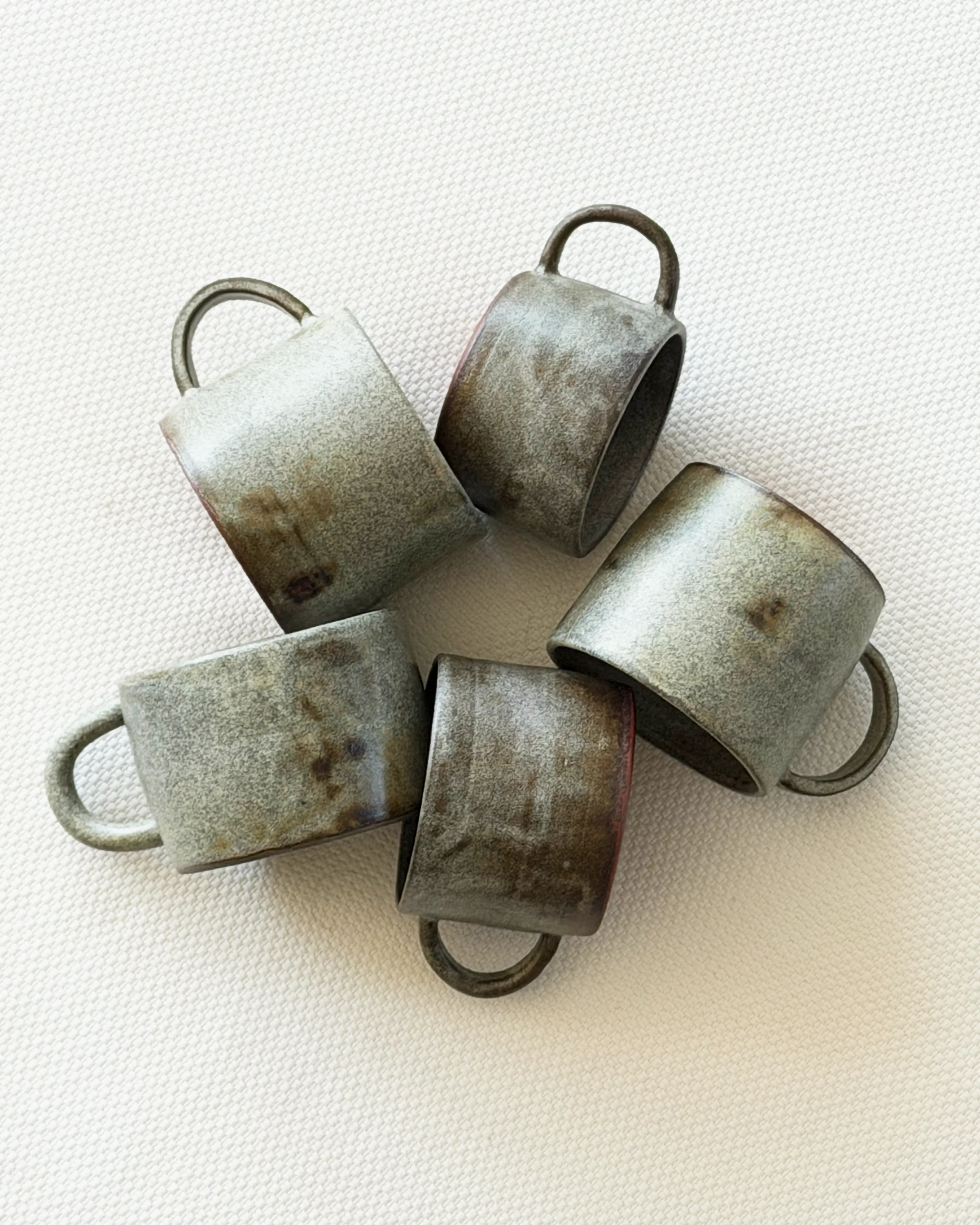 Circle of handcrafted ceramic cups